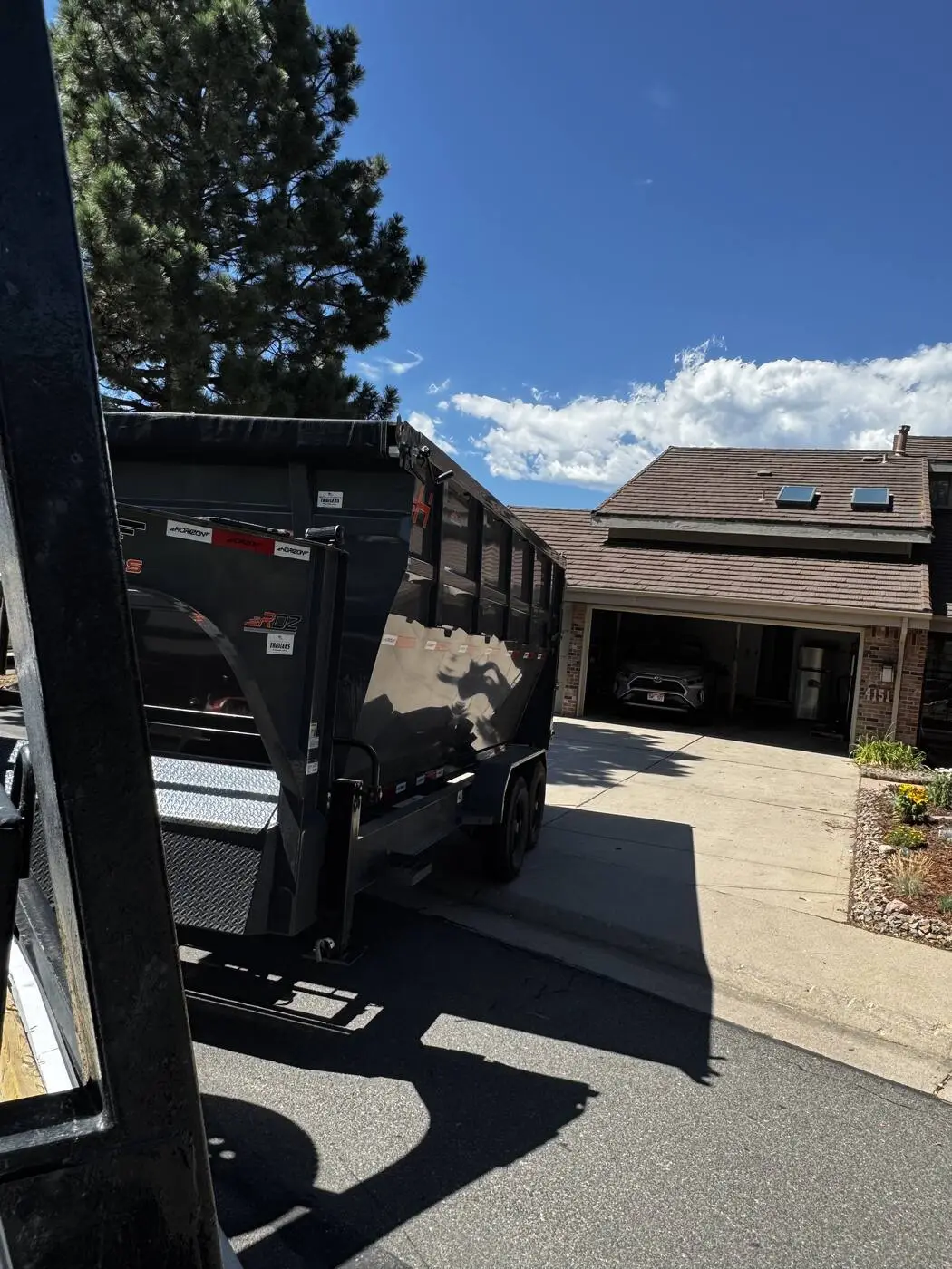 Dumpster trailer parked at a Denver metro home