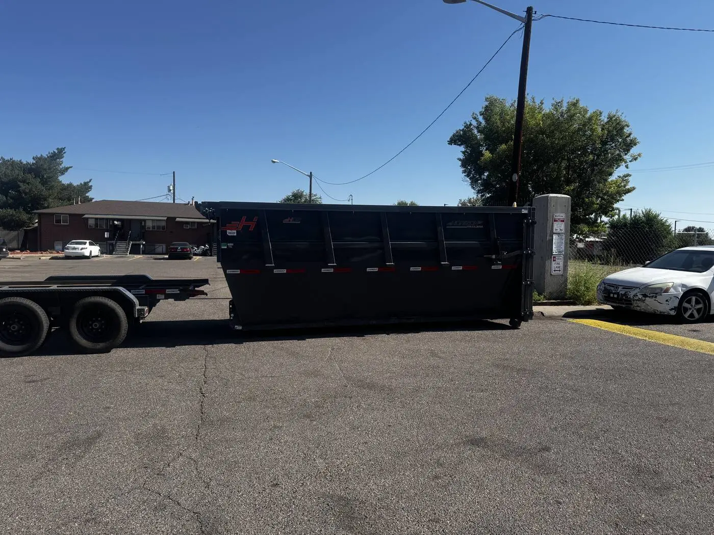 Roll-off dumpster on a residential street near Denver